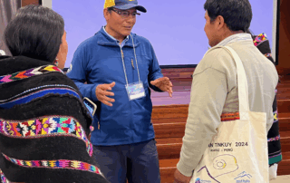 Saúl Luciano Lliuya interacts with community leaders from around Peru during the Hatun Tinkuy 2024. Melting glaciers are a top concern for climate advocates across the Andes and the world. Photo by Julia Klein.