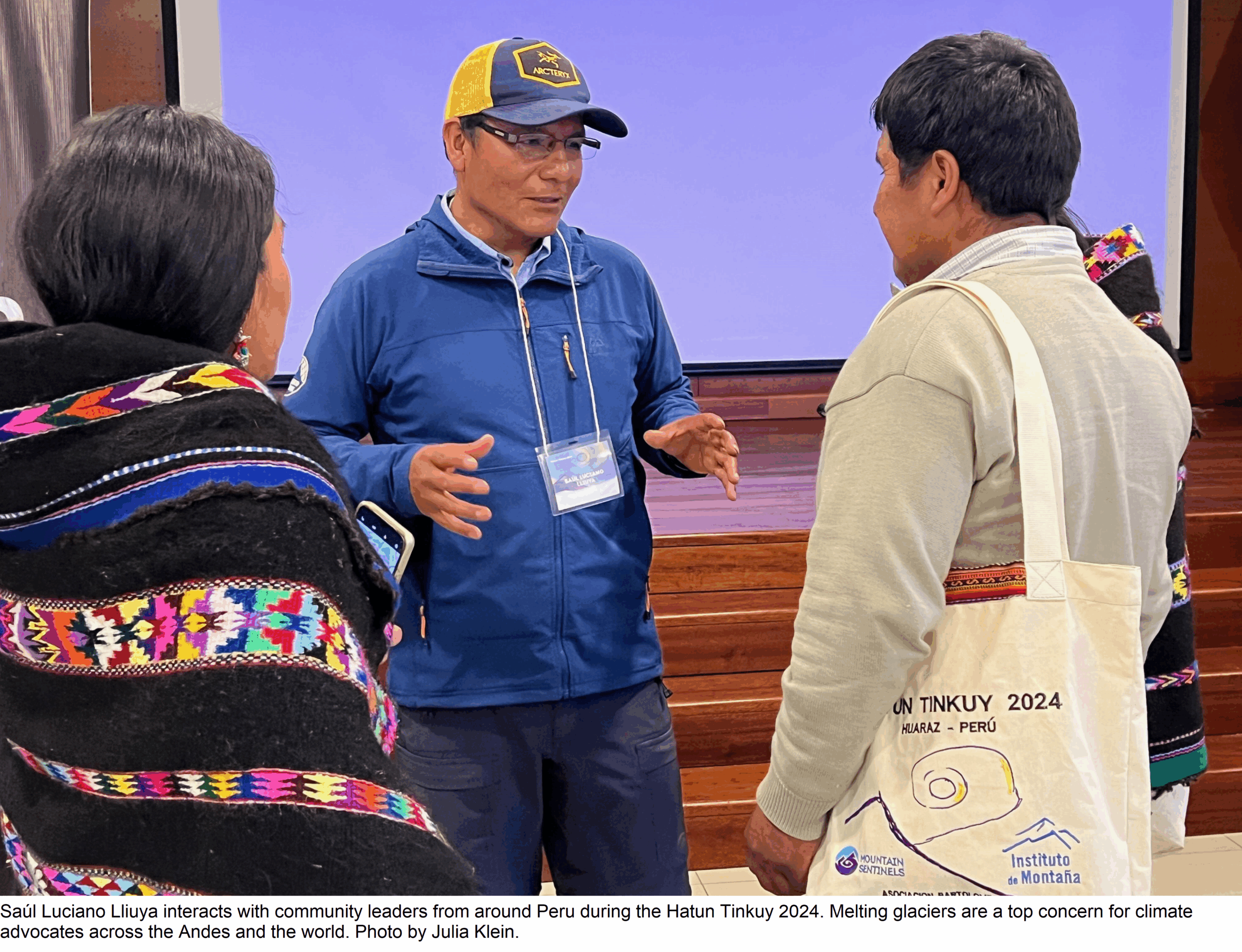 Saúl Luciano Lliuya interacts with community leaders from around Peru during the Hatun Tinkuy 2024. Melting glaciers are a top concern for climate advocates across the Andes and the world. Photo by Julia Klein.