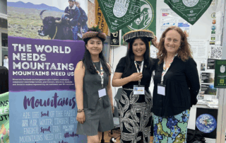 Shantal Pacotaype Mendieta, Ana Gabriela Pumacayo Marcabellaca and Julia Klein in front of their exhibit at COP30.